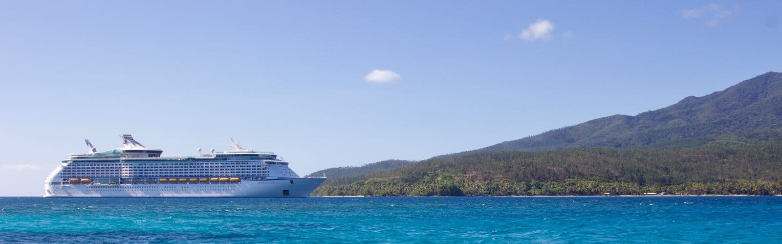 A cruise ship near a tropical island